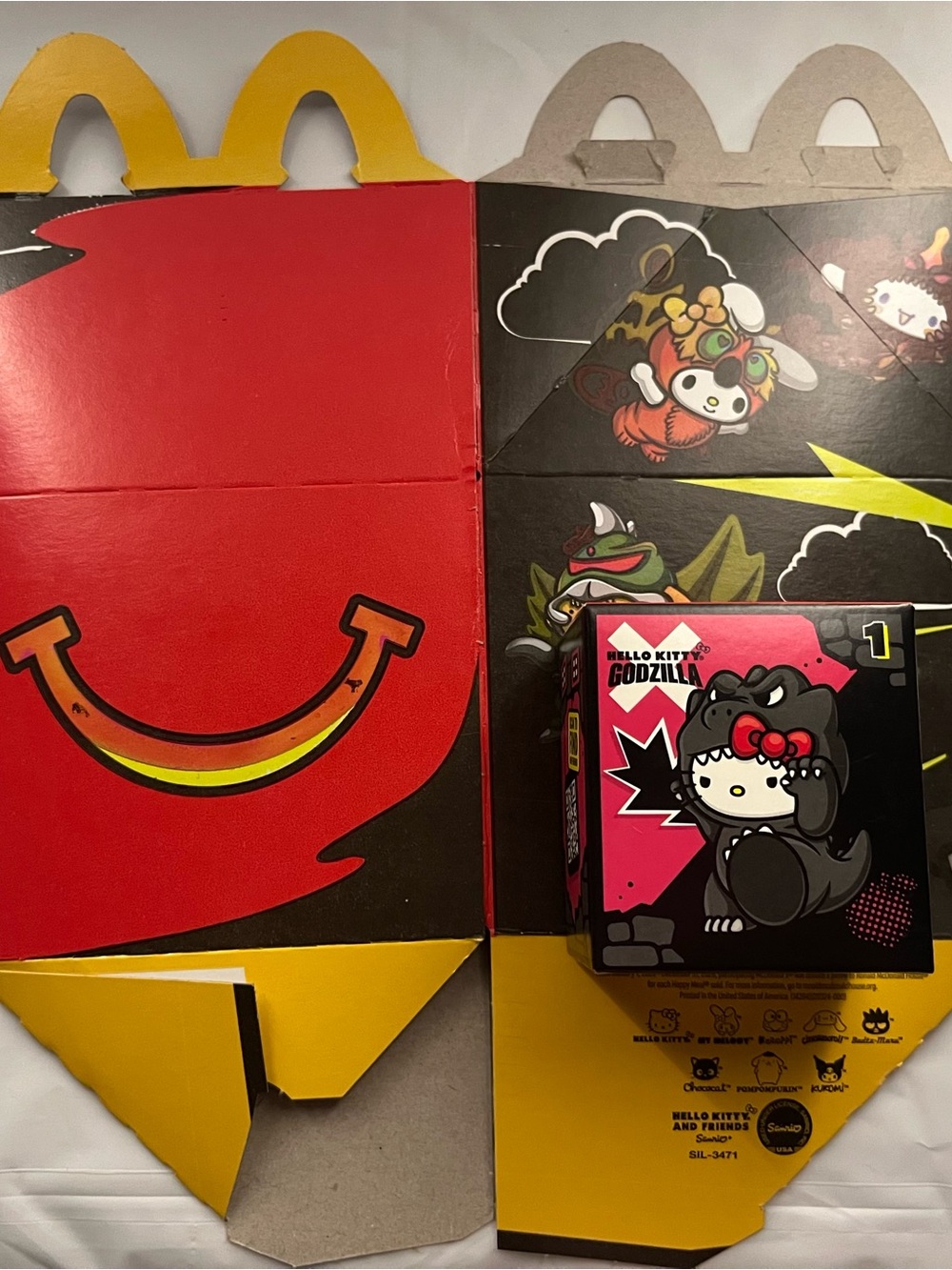 Hello Kitty Godzilla McDonald’s Happy Meal figure and box
